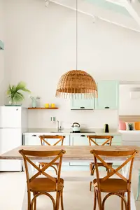 Two-Bedroom Casita dining area and kitchen at Boardwalk Boutique Hotel Aruba with open-plan layout