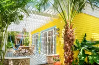 One-Bedroom Casita exterior at Boardwalk Boutique Hotel Aruba surrounded by lush tropical gardens.