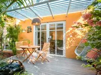 Coco Deluxe Casita private terrace with outdoor dining and tropical garden setting at Boardwalk Boutique Hotel Aruba.